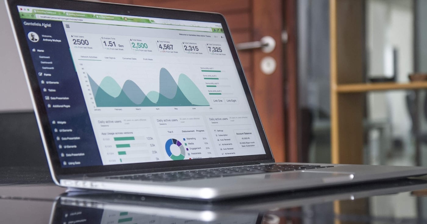 Analytics dashboard on laptop — demand generation tools hero