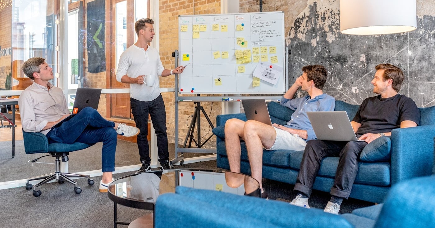 Team reviewing a strategy whiteboard during a positioning workshop