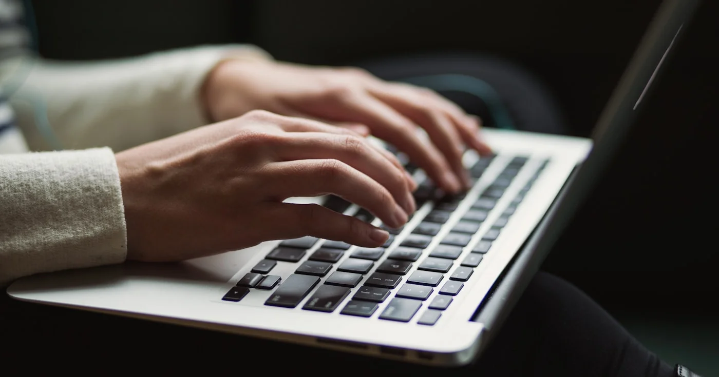 Person working on SEO tools on a laptop