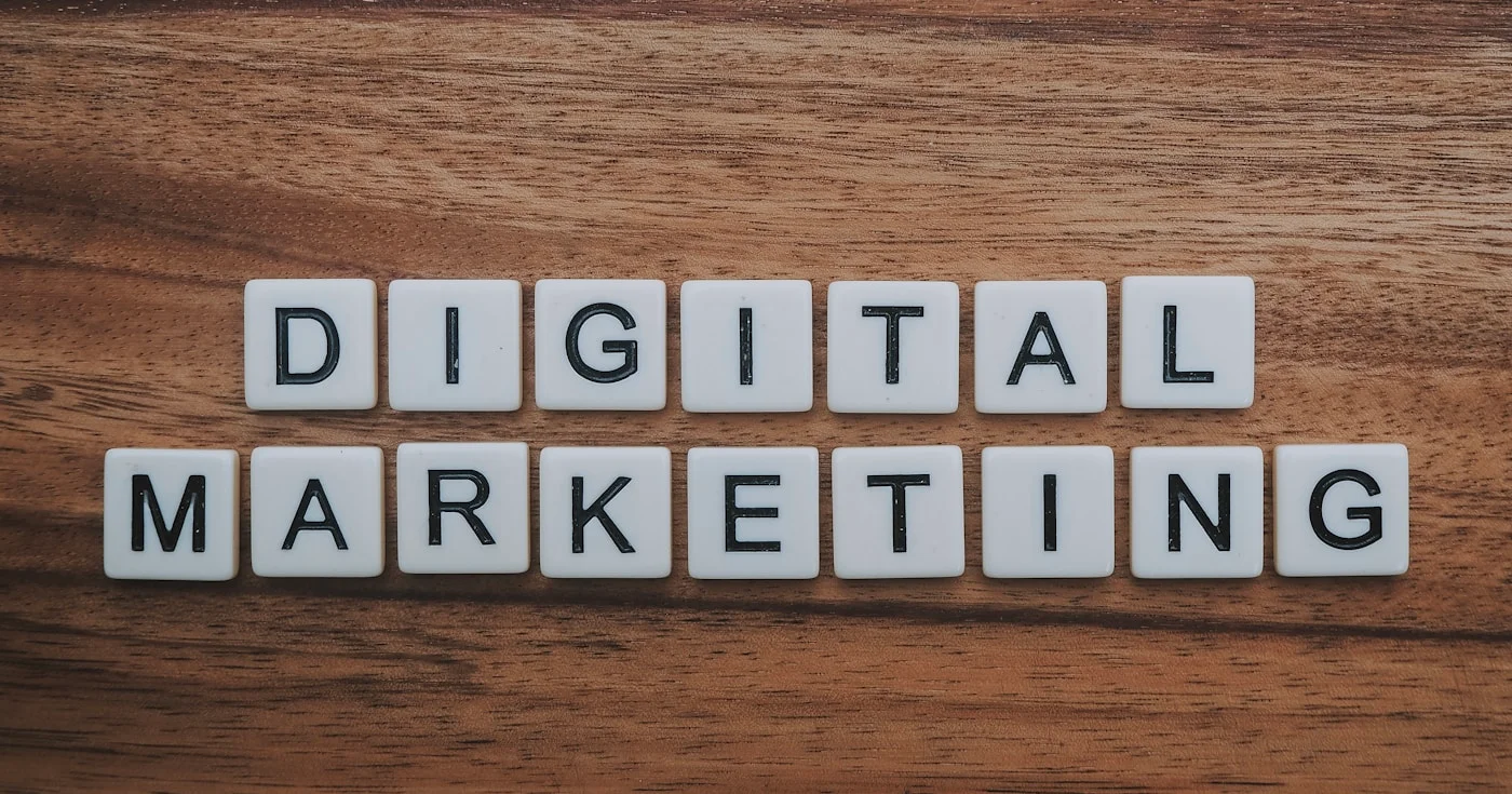 Digital marketing letter tiles on wooden surface representing performance marketing strategy